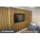 Behavioral health TV enclosure in communal environment