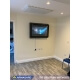 Wall-mounted behavioral health TV enclosure in sensory environment