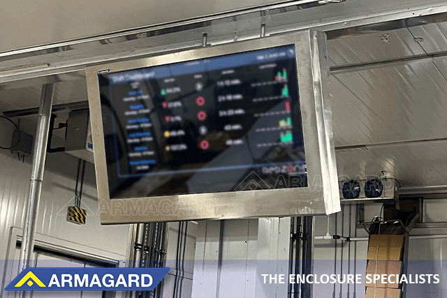 A 75 inch stainless steel TV enclosure showing KPIs in a food processing plant