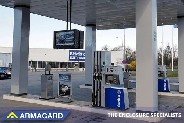 Armagard gas station digital signage enclosures mounted from a gas station canopy