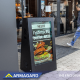 View the interactive sandwich board in use outside a restaurant