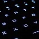 Illuminated keyboard keys lit up close view