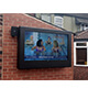 An Outdoor TV Enclosure 55 Inch on Wall in Pub Yard