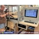 A worktop-mounted industrial computer workstation installed in a woodshop