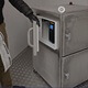 An Armagard team member showcases the SPRI-800 heated printer enclosure printing labels in a -22°F environment