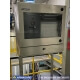 A rail-mounted waterproof PC enclosure installed in a food processing facility