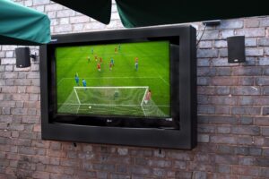 outdoor tv enclosure used in a pub beer garden