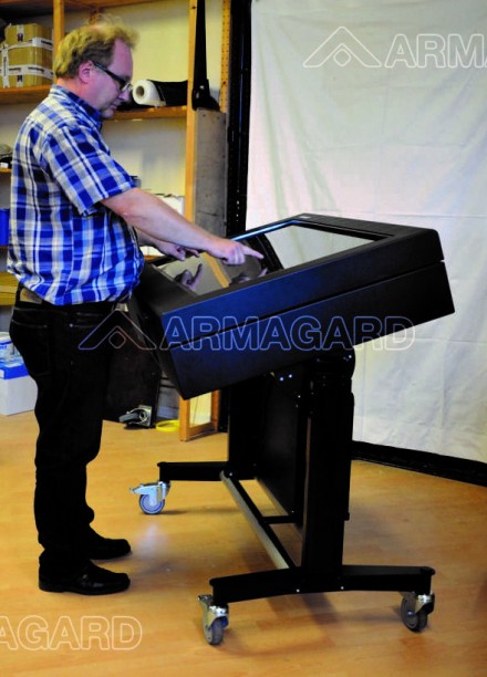 A man operating a Touchscreen LCD enclosure | Armagard 2012