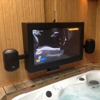 A sauna room equipped with an outdoor TV cabinet