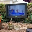 An outdoor TV cabinet in an external seating area